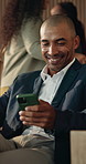 Laughing, phone and travel with business man in airport for communication, flight or response. App, social media and text message with funny employee in departure lounge for online chatting or typing