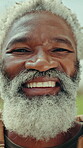 Wellness, face and man outdoor with smile, positive attitude or happiness on weekend break. Laughing, closeup or mature person in park with good mood, confidence and satisfaction on day off.