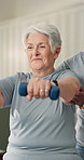 Physiotherapy, help and old woman in clinic with dumbbells, mobility and support for rehabilitation. Healthcare, senior person and equipment for physical therapy, exercise or assistance for recovery.