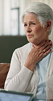 Healthcare, consulting or old woman with sore throat on sofa for flu diagnosis, illness or homecare. Tablet, senior person or checkup in home for chest pain, respiratory infection or explain symptoms