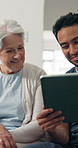 Happy, old woman and caregiver with tablet in nursing home, senior care or results review on website. People, laugh and nurse with tech for medical diagnosis, homecare and elderly patient recovery