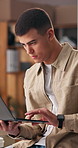 Man, typing and student in home with laptop for online university application with email feedback. Technology, relax and male person with computer for college scholarship submission in apartment.