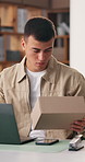 Man, reading and boxes with laptop in office for logistics, supply chain and ecommerce delivery. Male person, package and pc for online order, inventory management and pricing parcel for distribution