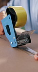 Person, hands and box with tape for logistics, delivery service or small business distribution. Closeup, distributor or supplier sealing package with parcel for supply chain, inventory or courier