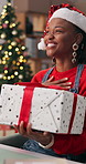 Christmas, office and black woman with surprise for gift for celebration, tradition and secret santa. Business, happy and person with present, thank you and giving for festive season, xmas or holiday