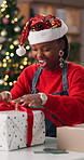 Christmas, office and black woman opening gift to celebrate, tradition or secret santa for shipping. Business, supply chain and person with present, box or surprise for festive season or xmas holiday