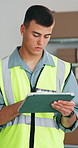 Supply chain, typing and man in warehouse, tablet for online checklist and report for manufacturing. Person, logistics and employee in factory, tech for quality assurance and app for distribution