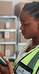 Inspection, typing and black woman in warehouse, tablet for online checklist and report for manufacturing. Person, review stock and employee in workplace, tech for schedule and app for distribution