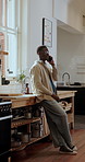 Phone call, connection and black man in kitchen, network for communication and happiness. Mobile user, smile and African person in home, app for online chatting or talking to contact or listening