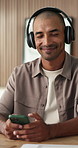 Dance, headphones or man in agency with phone, song streaming or listening to music playlist. Happy, rhythm or male person in office with technology, feeling beat or radio subscription on audio app.