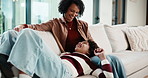Mother, daughter and relax on couch with conversation, bonding together and laugh for funny gossip. Happy, mom and child chill in house with discussion, joke and family connection on weekend break.