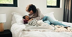 Sick, kiss and mother with daughter in bedroom for fever monitor, healthcare and disease check. Medical, illness and virus infection with woman and child in bed in family home for recovery and trust