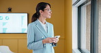 Businesswoman, smile or thinking by window with phone, email notification or idea for data analysis. Happy, mature person or analyst in office with tech, vision or graph stats for company performance