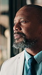 Thinking, business and black man by glass for finance strategy, investment decision and plan. Corporate, office and mature person with reflection with ideas, insight and solution for financial growth