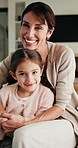 Happy, relax and face of mother with child on sofa in home with bonding, love and connection together. Smile, portrait and mom with girl kid for support, care and safety in living room at house.