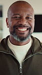 Relax, man and happy with face in home for weekend break, peaceful morning and unwind on day off. Chill, mature black person and laughing in living room for comfortable afternoon, wellness or me time
