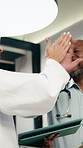 Doctor, team and high five in hospital with tablet, medical research or success for patient diagnosis. Mature people, discussion or celebration with tech, achievement or collaboration for healthcare