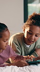 Children, girl and tablet on bed with smile, games and online contest with bonding, love and connection. Happy kids, sister and tech for play on app, streaming and digital puzzle in family house