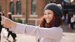 Woman, selfie and holiday in city with phone, social media post and connectivity for online blog update. Happy, female person and photography outdoor in urban town with tech, vacation and memories.