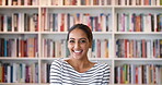 Face, education and indian woman with laugh in library, university student and learn for scholarship, Portrait, space and scholar with thesis research by bookshelf, knowledge development and smile