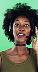 Face, black woman or consultant with headset in studio for online advice on a green background. Portrait, female person or friendly agent talking with smile or mic for CRM, help or virtual assistance