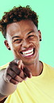 Face, smile and black man pointing at you for choice, recruitment and selection in studio. Portrait, happy person and gesture for decision, opportunity and hiring or promotion on green background