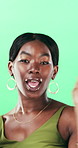 Face, dance and black woman with smile in studio, self expression and movement to celebrate winning. Portrait, music or happy person with energy on green background, entertainment or groove to rhythm