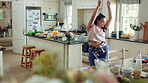 Dancing, woman and fun with spoon in kitchen, meal prep and moving with energy on weekend or playful. Happy person, singing and stress free with rhythm, cooking and celebration for success in house