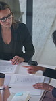 Above, documents and business women in meeting for finance report, budget planning and portfolio. Team, office and workers with paperwork in discussion for financial strategy, proposal and feedback
