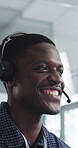 Headset, smile and support with black man in call center for advice, consulting or feedback. Assistance, contact us and solution with happy agent in office for communication, crm or customer service