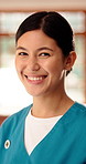Happy, woman and face of nurse in nursing home with confidence for career in medical service. Happy, professional and portrait of female healthcare worker with pride for about us at facility.