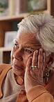 Memories, regret and retirement with senior woman in home living room for reflection or nostalgia. Perspective, sadness and thinking with old person in apartment for contemplation, ideas or remember