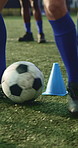 Legs, person and ball with cone for soccer, fitness or practice for running guide and exercise. Athlete, beacon and warm up challenge with football, agility and performance for game training on field