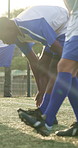 People, legs or soccer team on field with warm up, cardio exercise together or fitness for competition. Athlete, men or footballer group in sports club with stretching, outdoor or shoes for training.