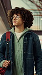 Man, student and walk with backpack on campus for education, study material and lesson change. Thinking, male person or morning journey to attend class, university navigation and learning scholarship