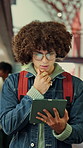 Student, education and man with tablet in library, thinking or academic growth with ebook on website. University, knowledge and person with tech for exam preparation, reflection and reading research