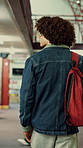 Back, man and student with backpack in library for education, study material and lesson change. Thinking, male person or morning journey to attend class, university resources and learning scholarship