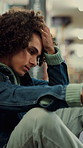 Man, library and frustrated student with stress, exam fail or education pressure in college. Upset, university and person with depression on floor for bad grades, assignment deadline and overwhelmed