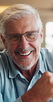 Laugh, face and elderly man in home for relax, chill and enjoy weekend in living room. Sofa, retirement and portrait of senior person with smile on couch for confidence, joy and funny joke in house