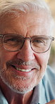 Happy, face and elderly man in home for relax, chill and enjoy weekend in living room. Sofa, retirement and portrait of senior person with smile on couch for confidence, joy and cheerful in house