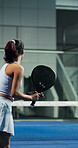 Fitness, padel and woman with racket for swing practice, sports training and coordination development. Back, tennis gear and player with exercise for contest preparation, active and hit ball on court