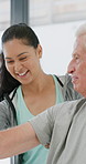 Physiotherapist, help and senior man with exercise, dumbbells or fitness for muscle recovery. Happy physical therapist, elderly patient or weightlifting for wellness, strength or healthcare clinic
