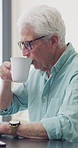Senior man, writer and thinking with coffee in home for inspiration, online story or digital novel. Thoughtful, author or elderly male person with cup, glasses or drink for ebook, research or edit