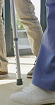 Walker, legs and nurse with support for person in clinic, rehabilitation or physical therapy. Walking, health care and help in house with injury, osteoporosis or arthritis for recovery or mobility