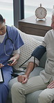 Woman, nurse or elderly patient with blood pressure machine for medical exam or test in home. Female person, caregiver and monitoring senior client with clipboard for hypertension or checkup in house