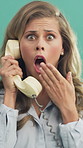 Face, phone call and wow with woman in studio for reaction to bad news, gossip or rumor. Landline, retro telephone and surprise with person on green background for announcement or communication