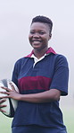 Face, rugby and black woman outdoor for sports, game training and confidence for wellness on pitch. Portrait, proud player and athlete with ball at field for exercise, practice and smile with fitness