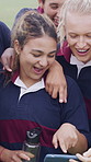 Discussion, rugby team or people with phone, check field position or funny practice video for laughing. Pointing, outdoor and happy women with mobile for match day planning, joke and sports chat