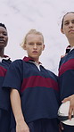 Face, women and rugby team at field for sports, game training and serious on pitch together. Portrait, proud players or athlete with ball outdoor for exercise, determination or fitness with low angle