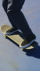 Skateboarding, trick and legs outdoor with action, stability control and backflip technique in fitness hobby. Jump, rider or man with board, mobility performance and balance skills in Los Angeles.